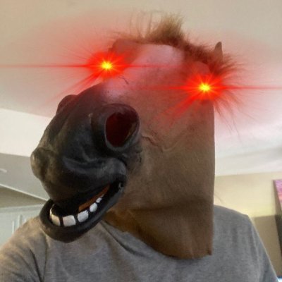 J-Dog in a horse mask, eyes glowing red